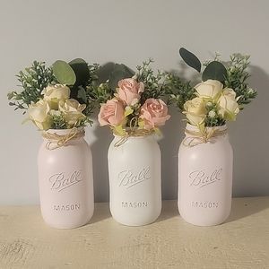Roses in beautiful hand painted masonry jars.